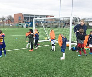 Children at Vauxhall Sports Club playing football