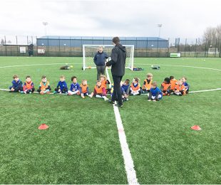 Children listening to the coach at Vauxhall Sports Club