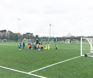 Children at Vauxhall Sports Club learning how to play football