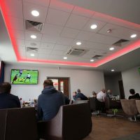 People watching football in the Vauxhall Sports Cafe